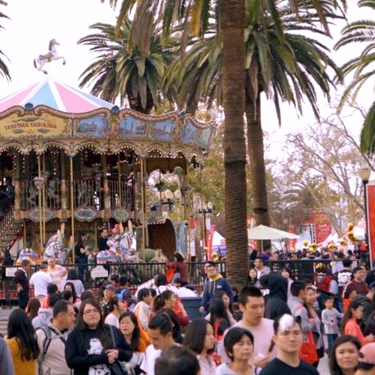 Carousel ride surrounded by visitors