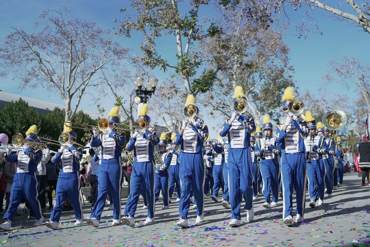Marching band performing with confetti in the air