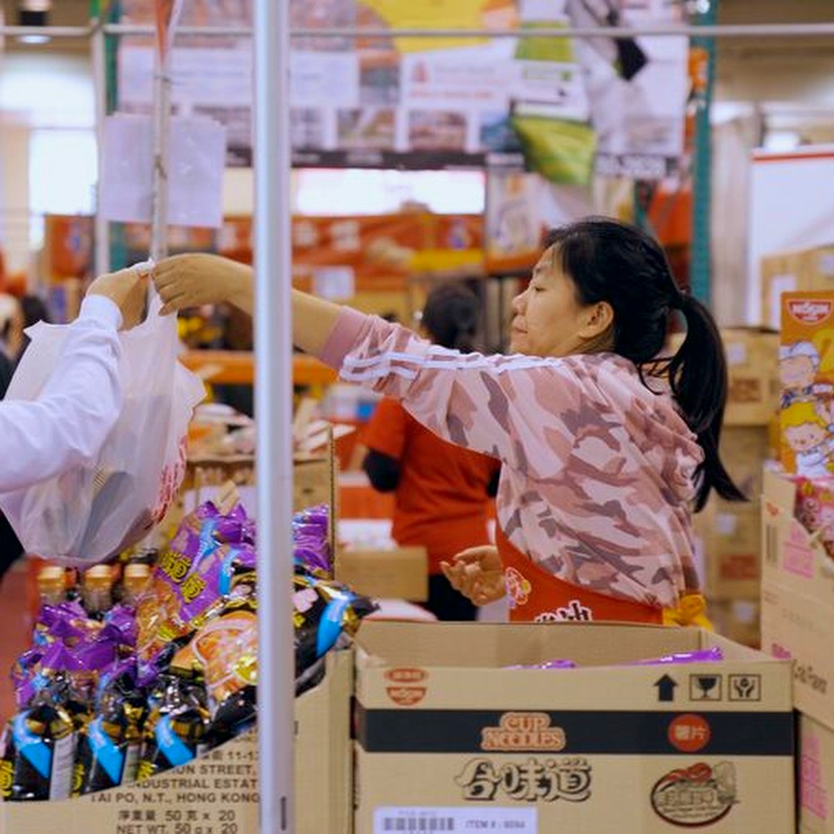 Visitors shopping at a vendor booth
